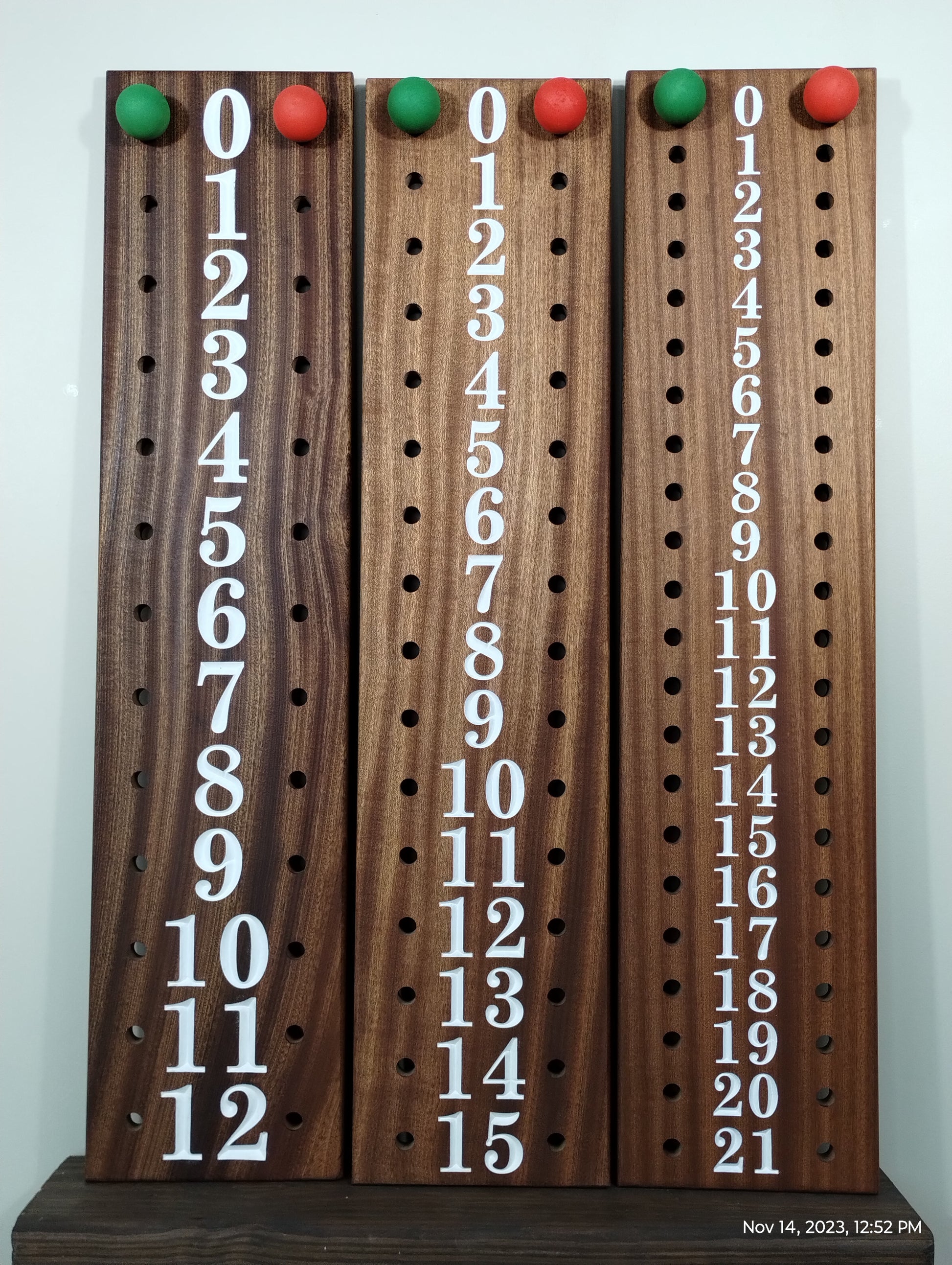 Numbered mahogany scorebards