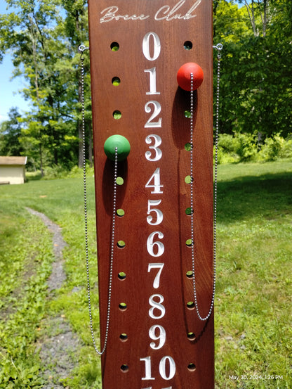 Mahogany bocce scoreboard numbered 0-12 with scoring pegs and chain