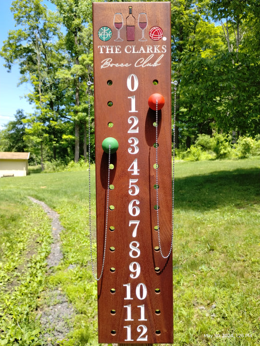 Mahogany bocce scoreboard numbered 0-12 with scoring pegs and chain