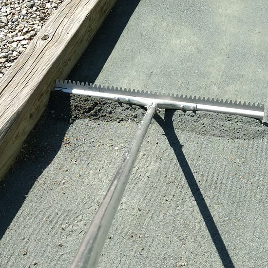 Bocce rake cleaning and leveling a bocce court
