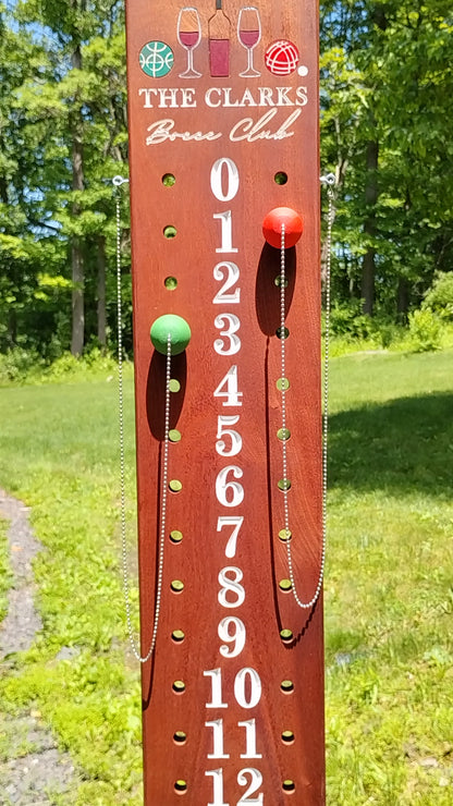 Mahogany bocce scoreboard numbered 0-12 with scoring pegs and chain