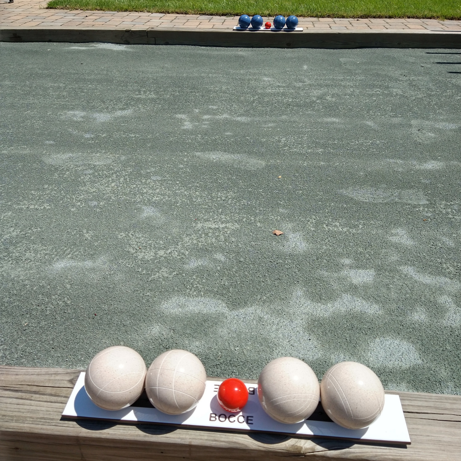 Bocce ball rack with white and blue EPCO bocce balls
